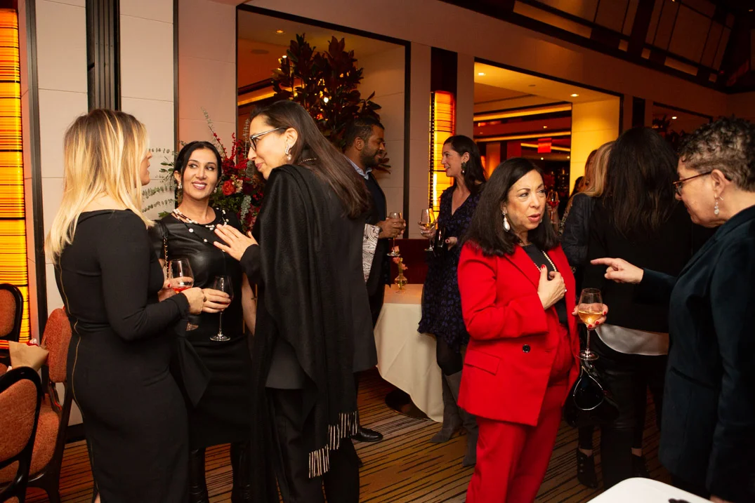 Candid networking conversation • NYC corporate event photographer