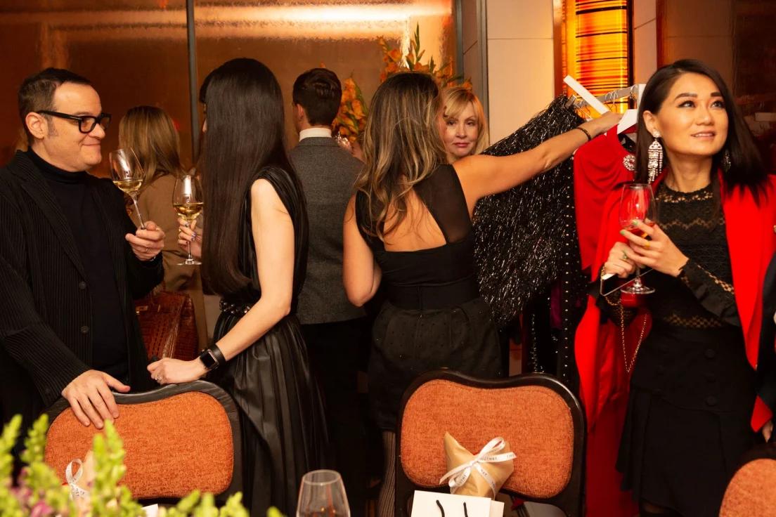 Candid networking conversation • Outnet Fashion • NYC corporate event photographer