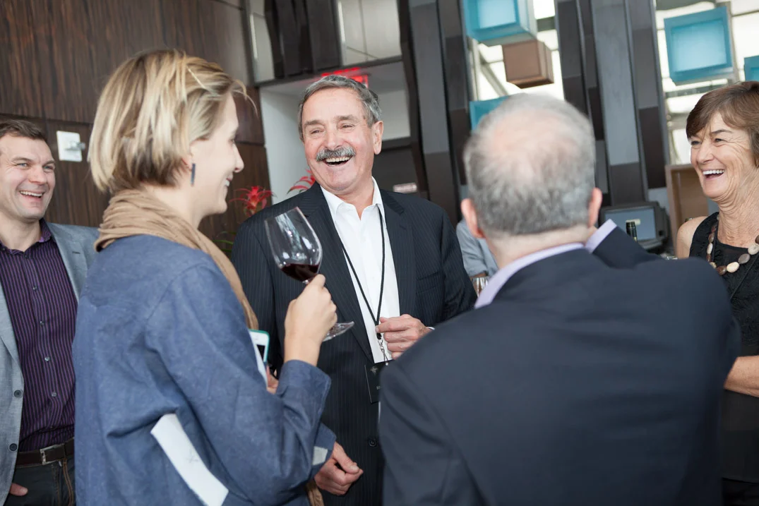 Candid networking conversation • NYC corporate event photographer