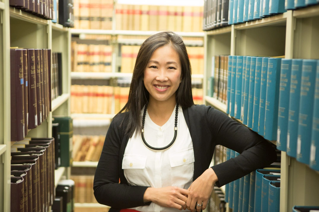 Attorney headshot with bookshelf background — Financial District — NYC portrait